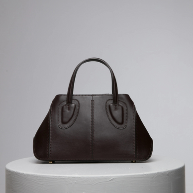 Ev stands for home, something we treasure as a family and team. Now this family has a micro version of it too! This non-structured tote was thought to be one of our strongest styles by bringing absolute function and practically to a new distinctive level as size goes within our collections. Ev Micro's soft leather allows women to be versatile and dynamic thanks to its shapeless capability. Ev is certainly that elevated. Twist it, fold it with the magnets at the sides, it is a perfect daily bag with a short leather handle or it becomes shoulder bag with removable cross body strap. 
 

DETAILS

18 cm (H) x 13 cm (W) x 6,5 cm (D)
%100 Calf Leather 
%100 calf suede interior
Hand carry, shoulder carry and crossbody carry
Embossed NATURAE SACRA lettering at front 
Dust bag included 





 
PRODUCT CARE



CALF LEATHER:   Each leather hides unique characteristics such as texture and natural markings. Also, the most prominent feature of vegetal tanned leather is that it changes color with usage. Aging and tone variations should not be considered an imperfection as leather is a natural product. Please, avoid contact with water and any oil-based substances. 
 






Fulfilled by our friends at NATURAE SACRA 
*Please Note: 

 Rewards cannot be applied to this product
This item is not eligible for returns 
This item cannot be shipped outside the U.S.





  