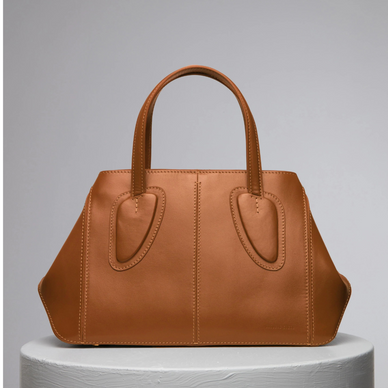 Ev stands for home, something we treasure as a family and team. Now this family has a midi version of it! This non-structured tote was thought to be one of our strongest styles by bringing absolute function and practicality to a new distinctive level as size goes within our collections. Ev Midi's soft leather allows women to be versatile and dynamic thanks to its shapeless capability. Ev is certainly that elevated. Twist it, and fold it with the magnets at the sides, it is a perfect daily bag with a short leather handle or it can become a shoulder bag with a removable cross-body strap. 
 

DETAILS

25 cm (H) x 23 cm (W) x 8 cm (D)
%100 Calf Leather 
%100 calf suede interior
Hand carry, shoulder carry and crossbody carry
Embossed NATURAE SACRA lettering at front 
Dust bag included 





 
PRODUCT CARE



CALF LEATHER:   Each leather hides unique characteristics such as texture and natural markings. Also, the most prominent feature of vegetal tanned leather is that it changes color with usage. Aging and tone variations should not be considered an imperfection as leather is a natural product. Please, avoid contact with water and any oil-based substances. 
  





Fulfilled by our friends at NATURAE SACRA 
*Please Note: 

 Rewards cannot be applied to this product
This item is not eligible for returns 
This item cannot be shipped outside the U.S.



