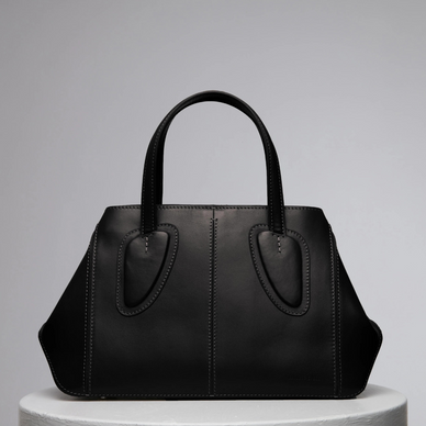 Ev stands for home, something we treasure as a family and team. Now this family has a midi version of it! This non-structured tote was thought to be one of our strongest styles by bringing absolute function and practically to a new distinctive level as size goes within our collections. Ev Midi's soft leather allows women to be versatile and dynamic thanks to its shapeless capability. Ev is certainly that elevated. Twist it, fold it with the magnets at the sides, it is a perfect daily bag with a short leather handle or it becomes shoulder bag with removable cross body strap. 
 

DETAILS

25 cm (H) x 23 cm (W) x 8 cm (D)
%100 Calf Leather 
%100 calf suede interior
Hand carry, shoulder carry and crossbody carry
Embossed NATURAE SACRA lettering at front 
Dust bag included 





 
PRODUCT CARE



CALF LEATHER:   Each leather hides unique characteristics such as texture and natural markings. Also, the most prominent feature of vegetal tanned leather is that it changes color with usage. Aging and tone variations should not be considered an imperfection as leather is a natural product. Please, avoid contact with water and any oil-based substances. 





Fulfilled by our friends at NATURAE SACRA 
*Please Note: 

 Rewards cannot be applied to this product
This item is not eligible for returns 
This item cannot be shipped outside the U.S.





  