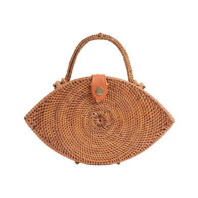 Discover the "Iris" Handmade Rattan Purse, a captivating accessory that marries artisanal craftsmanship with symbolic elegance. Expertly crafted in Bali, this purse is thoughtfully designed in the shape of an evil eye, symbolizing protection and positive energy. The intricately woven rattan exterior evokes natural charm, while the vegan leather snap closure ensures security. Complete with a convenient top handle, the "Iris" purse seamlessly blends functionality and style, inviting good vibes and a touch of cultural mystique to your ensemble. 
Fulfilled by our friends at  Jelavu 
*Please Note: 

This item is not eligible for returns 
This item cannot be shipped outside the U.S.
