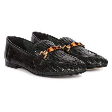 Meet Marisa, your new go-to for laid-back elegance! These woven leather loafers are all aboutcombining comfort with a touch of flair. Slip into the leather insoles and feel that cozy, relaxedvibe instantly. The bamboo horse bit detail adds that extra charm, giving off a rustic yet stylishfeel. Marisa isn't just about casual comfort; it's about effortlessly blending everyday ease with ahint of sophistication. Step out in these woven wonders and make comfort look oh-so-cool.  
Fulfilled by our friends at  Saint G 
*Please Note: 

This item is not eligible for returns 
This item cannot be shipped outside the U.S.
