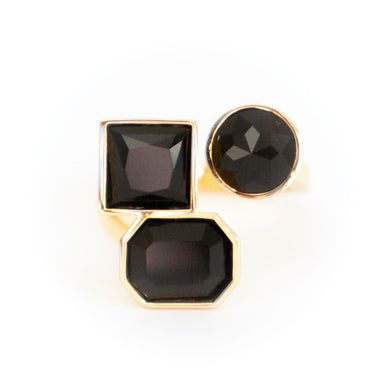   
One size fits all! Three’s a party with our fun and fabulous Multi-Stone Adjustable Ring in Black. Crafted with a flexible band for various sizing, this piece can be worn on any finger for optimal wow factor. 
Adjustable 14K Gold plating over brass with swarovski stones 
Fulfilled by our friends at Short Suite 
*Please Note: 

 Rewards cannot be applied to this product
This item is not eligible for returns 
This item cannot be shipped outside the U.S.
