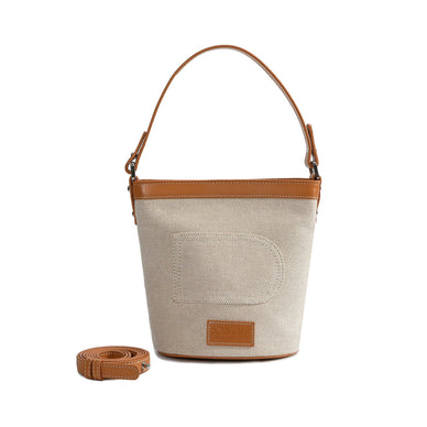  Never go wrong with the always handy Dorothy bucket bag. 

Genuine leather 

Canvas
Silver hardware

 7.8" x 9.53" x 7.68" (19.8cm x 24.2cm x 19.5cm) 

Button top closure
2 interior zipper pockets 

Adjustable shoulder strap
Imported

Fulfilled by our friends at Bob Oré 
*Please Note: 

Rewards cannot be applied to this product
This item is not eligible for returns 
This item cannot be shipped outside the U.S.
