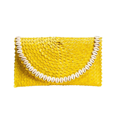 The fact that this clutch is handcrafted adds a unique and personal touch to your accessory collection. Handcrafted pieces often reflect artistry and attention to detail, making them special and one-of-a-kind. 
Crafted from rattan, this clutch celebrates the natural and sustainable beauty of woven materials. Rattan adds a touch of beachy elegance and pairs beautifully with summer fashion. 
 The snap closure is both secure and convenient, ensuring that your belongings are safe. It provides peace of mind during your summer outings and events. 
The Pandegelang Raffia Seashell Clutch is available in five striking colors. This variety allows you to choose the clutch that best matches your summer look and personal style. 
Handwoven Rattan bag  



Handcrafted
Rattan; polyester lining
Snap closure 
Imported




Dimensions 


6.7" x 11.5"

Fulfilled by our friends at  Jelavu 
*Please Note: 

This item is not eligible for returns 
This item cannot be shipped outside the U.S.

