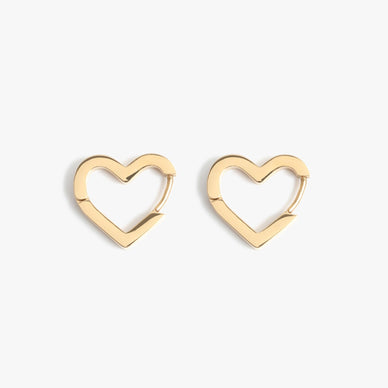 It’s all love over here! Our coveted heart-shaped motif is back and better than ever in an open and endless heart huggie design! With an invisible click hook hoop closure that is even comfortable enough to sleep in, this huggie is the perfect ‘grab-and-go’ earring set that will take you from day to night with ease and in style. Designer tip — rock this piece in consecutive earring holes for an unexpected edgy ear stack. Simply from the front, edgy and unexpected from the side — this heart duo is sure to become one of your everyday faves. 

15mm 
Click-tension hinge closure— for pierced ears

Fulfilled by our friends at MARRIN COSTELLO 

Please Note: Rewards cannot be applied to this product 