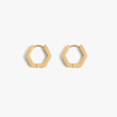 Our six-sided best-selling huggie does not disappoint! Featuring a geometric design, this stainless steel style is lightweight but packs an edgy punch. Delicate and durable, this huggie earring is has a slightly larger diameter than the Evelyn Huggies 5mm — and are great for stacking. A multifaceted size that can be worn in any ear piercing hole, this non tarnish + hypoallergenic + water resistant style is perfect to put on and never take off. Designer tip: give this simple and chic set of huggie earrings as a gift knowing that they hypoallergenic and water resistant — fit for every style + skin type! 

Click-tension hinge closure — for pierced ears
0.50" width, 0.45" length

Fulfilled by our friends at MARRIN COSTELLO 

Please Note: Rewards cannot be applied to this product 